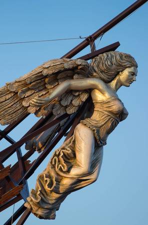 wooden masthead of a woman