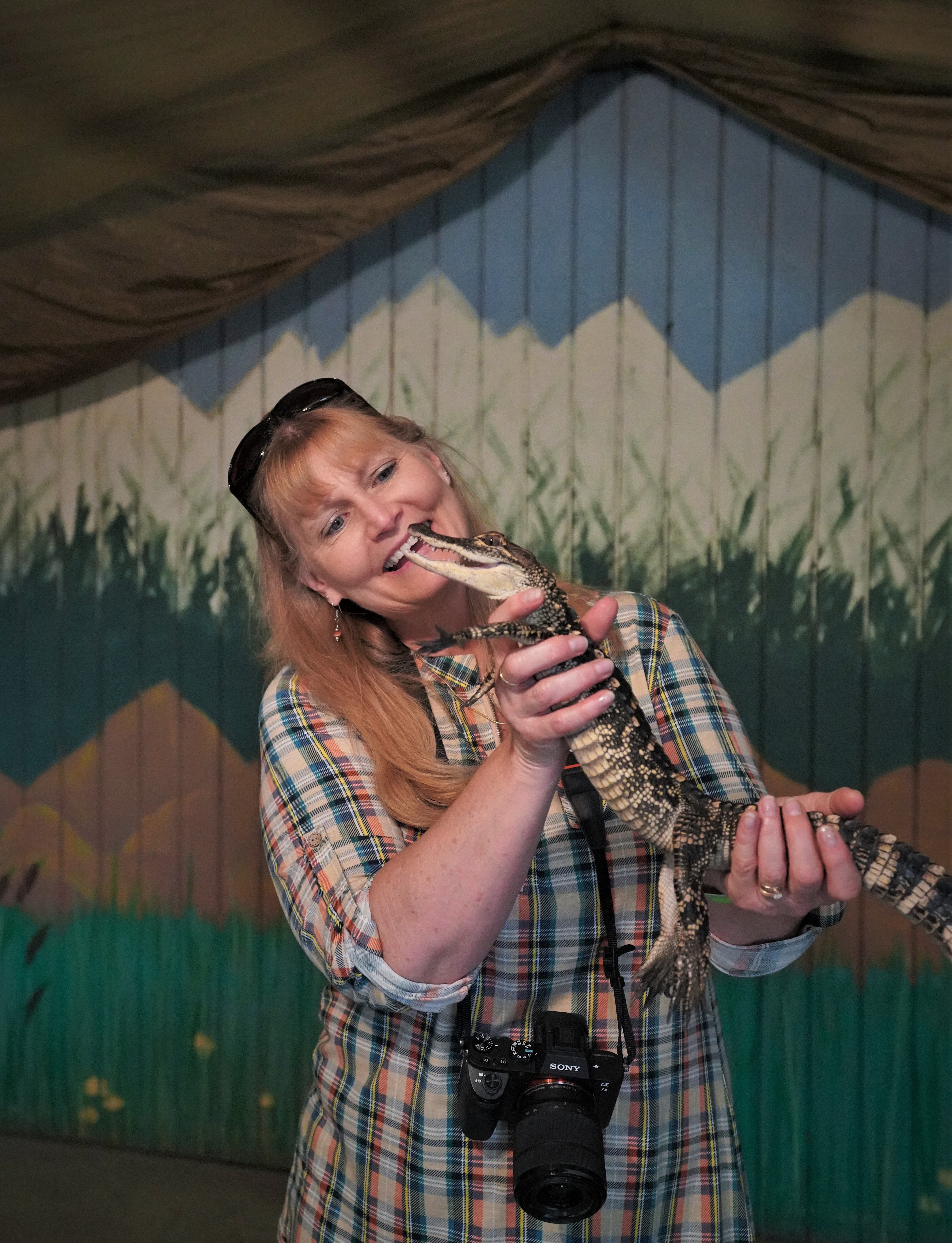 woman holding a caymen