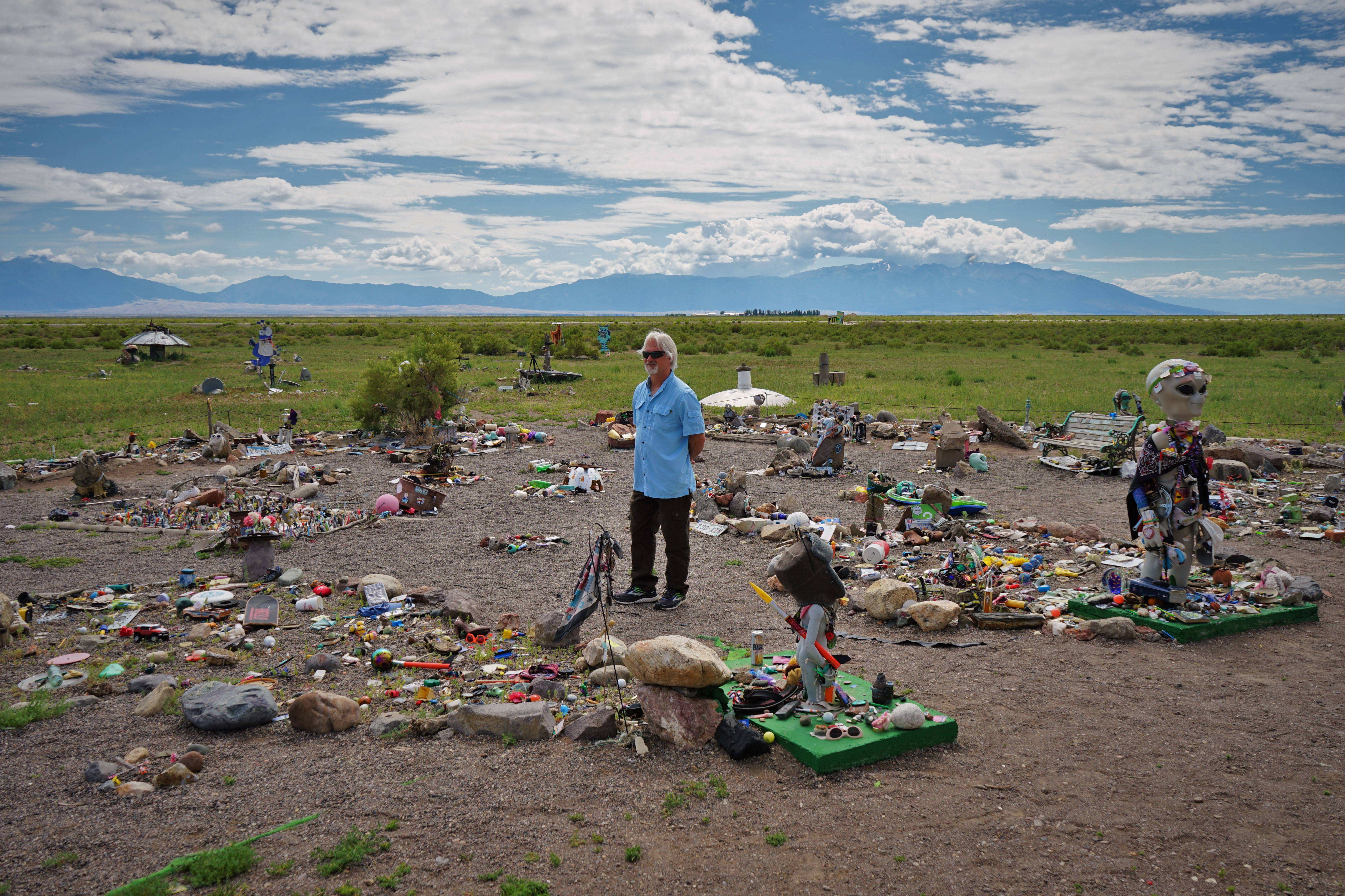 man standing in area filled with memorabilia