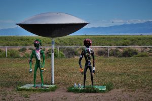 2 alien statues under UFO craft