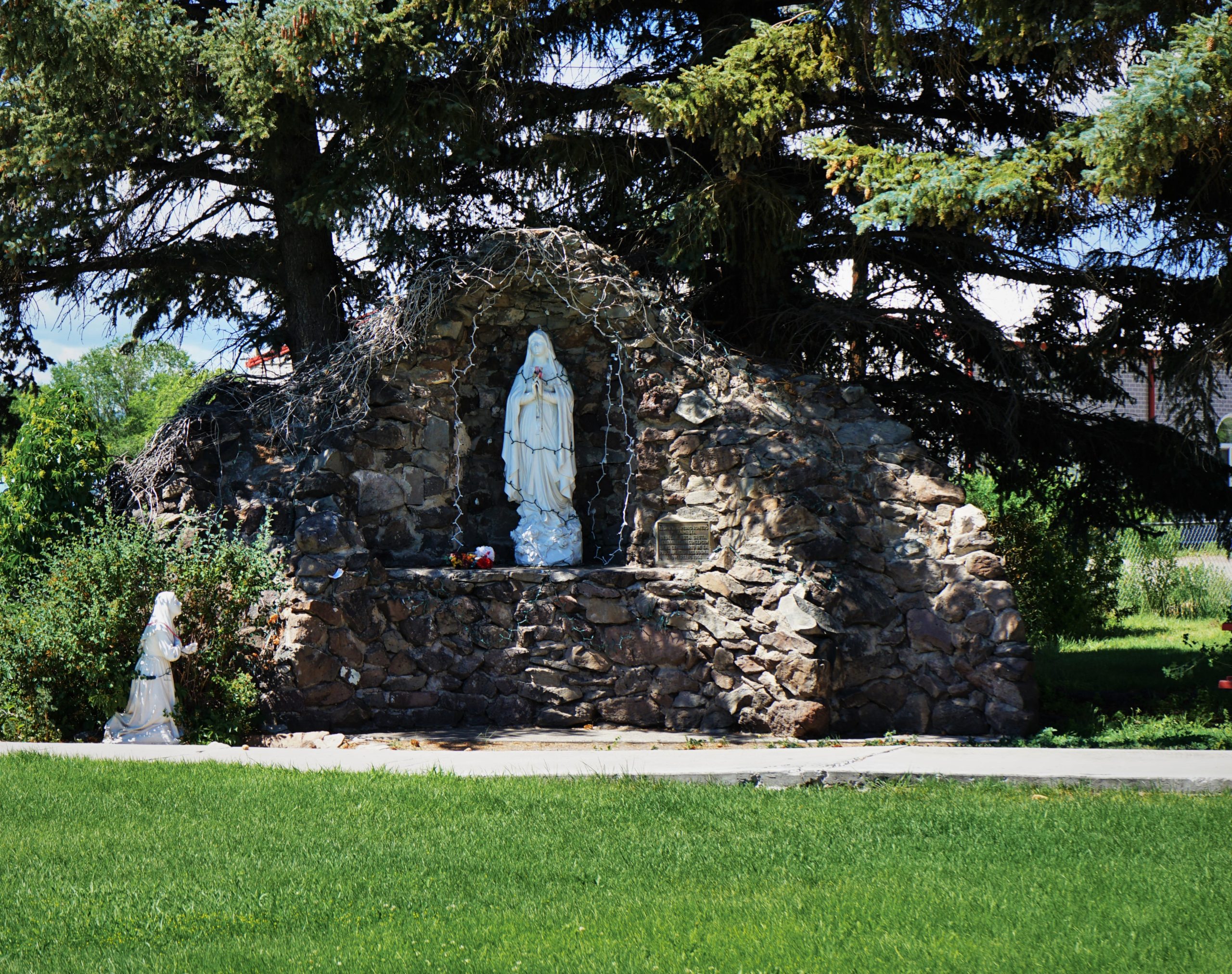 Our lady of Guadalupe statue holding flowers