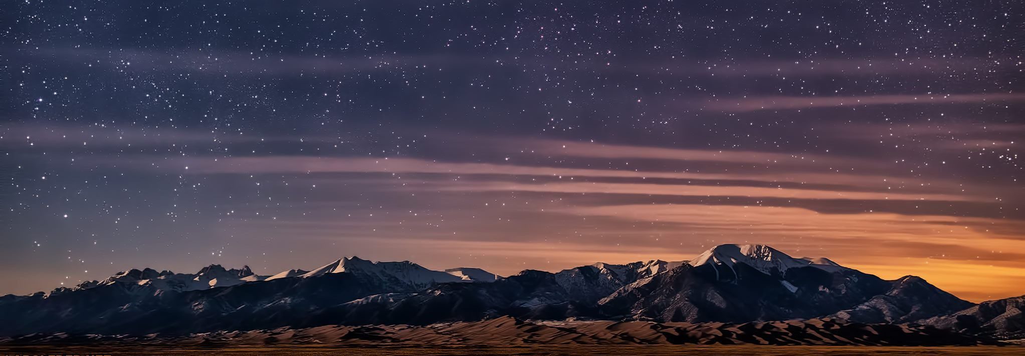 night sky with stars over mountains
