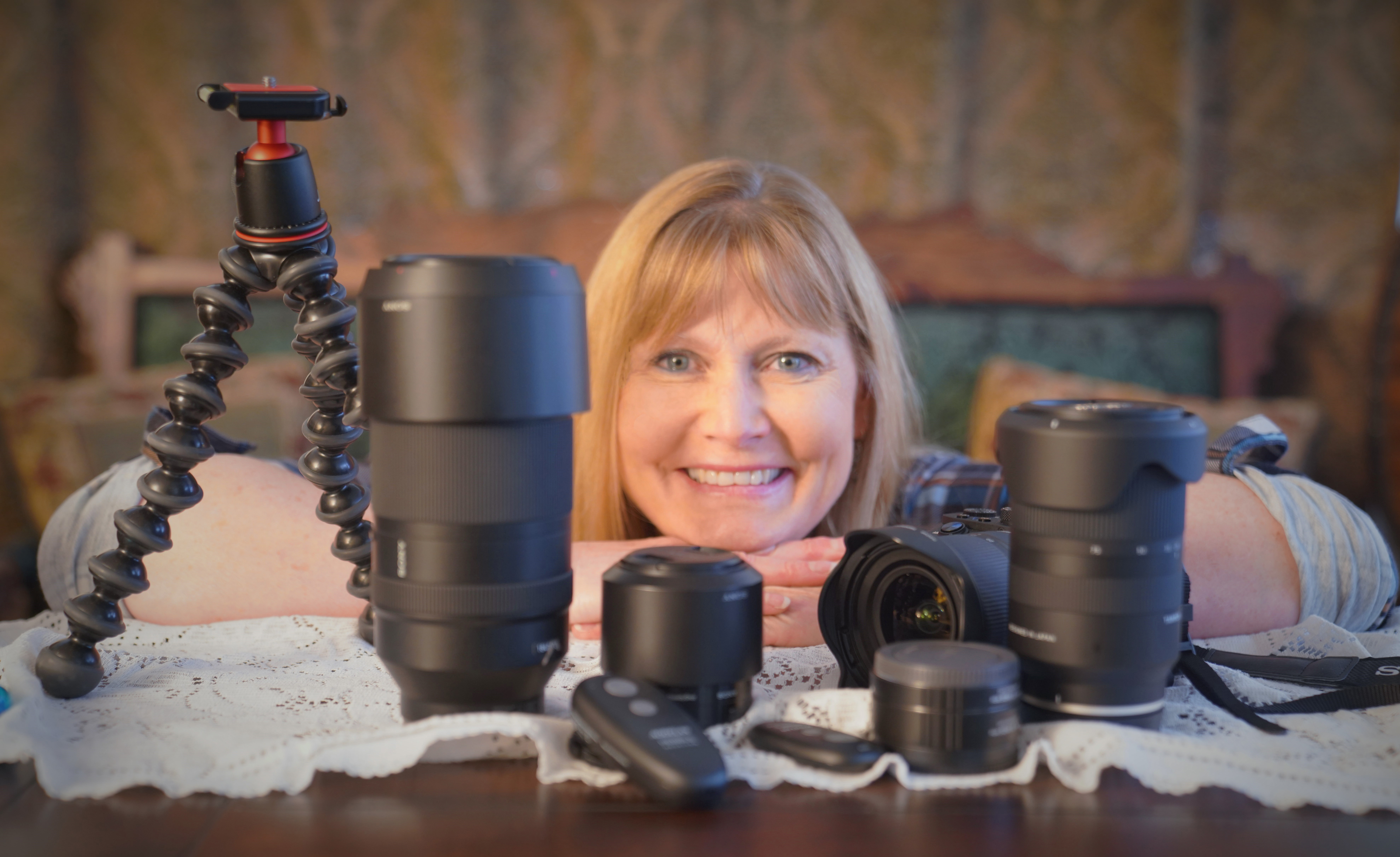 HAPPY LADY WITH CAMERA, LENSES AND ACCESSORIES