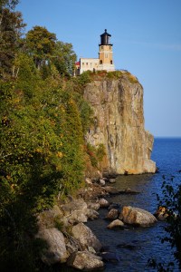 Lighthouse on rock overlooking lake