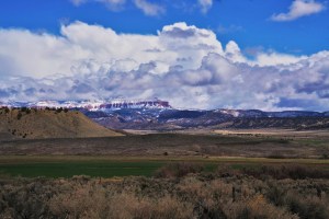 Farmland with blue skies and fluffy clouds