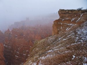 Hoodoos in the fog and snow at Bryce Canyonb
